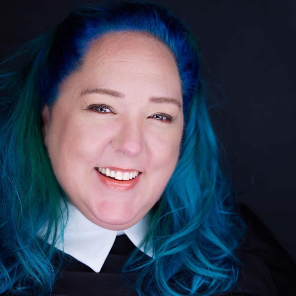 Angie Whitten portrait holding camera